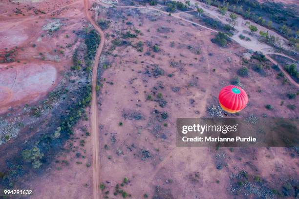 hot air ballooning over the desert - fun northern territory stock pictures, royalty-free photos & images