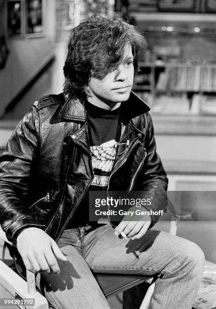 View of American Rock, County, and Folk musician John Cougar, a cigarette in his hand, during an interview at MTV Studios, New York, New York, May 4,...