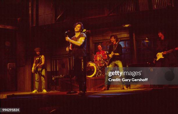 American Rock, County, and Folk musician John Cougar performs, with his hand the Zone, during a dress rehearsal for the television show 'Saturday...
