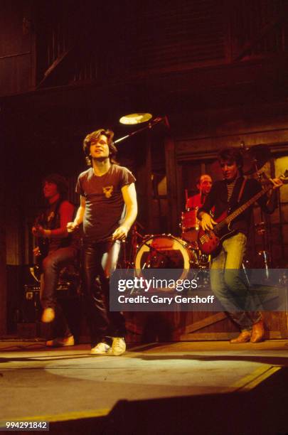 American Rock, County, and Folk musician John Cougar performs, with his hand the Zone, during a dress rehearsal for the television show 'Saturday...