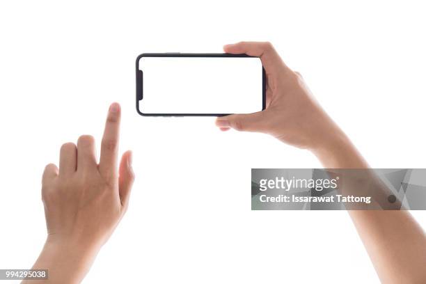 smartphone in female hands taking photo isolated on white blackground - horizontal stock-fotos und bilder