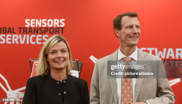 Prince Joachim of Denmark seen next to Danish Consul General Martine Gram Barbry at the joint booth of the Danish exhibitors at the 'HUSUM Wind' wind...