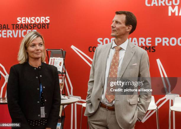 Prince Joachim of Denmark seen next to Danish Consul General Martine Gram Barbry at the joint booth of the Danish exhibitors at the 'HUSUM Wind' wind...