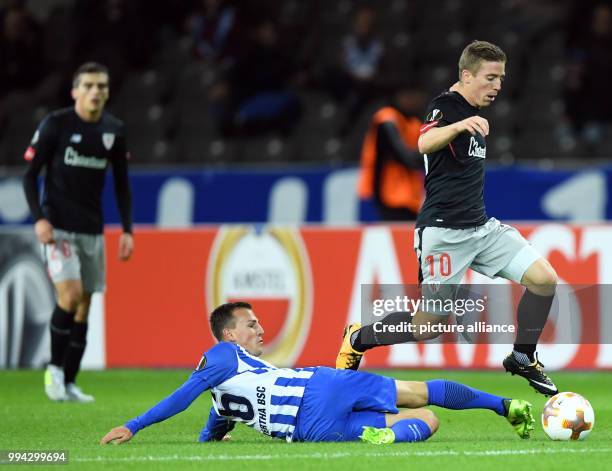 Hertha's Vladimir Darida and Bilbao's Iker Muniain vie for the ball during the UEFA Europa League group phase soccer match between Hertha BSC and...