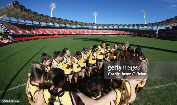Form a huddle during the AFLW U18 Championships match between Vic Metro and Western Australia at Metricon Stadium on July 9, 2018 in Gold Coast,...