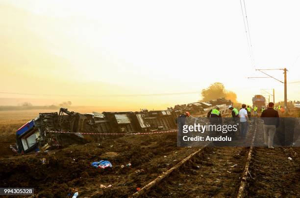 Officials work at the scene after several bogies of a passenger train derailed at the Sarilar village of Tekirdags Corlu district on July 09, 2018....