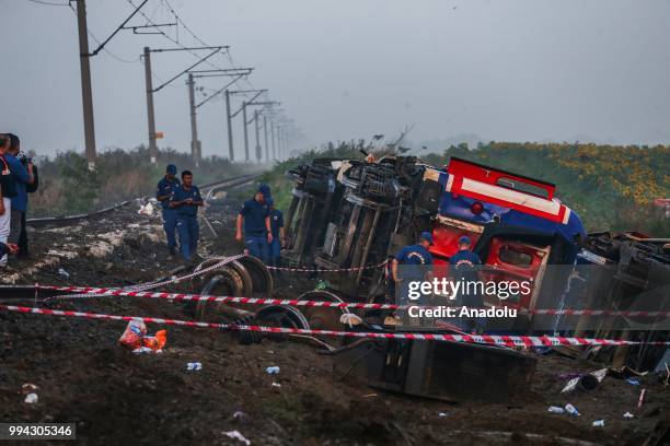 Officials work at the scene after several bogies of a passenger train derailed at the Sarilar village of Tekirdags Corlu district on July 09, 2018....