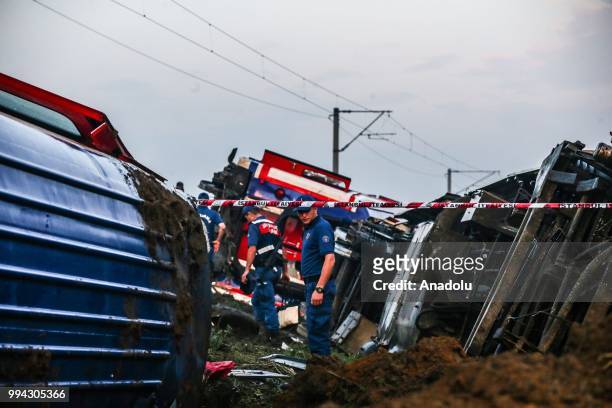 Officials work at the scene after several bogies of a passenger train derailed at the Sarilar village of Tekirdags Corlu district on July 09, 2018....
