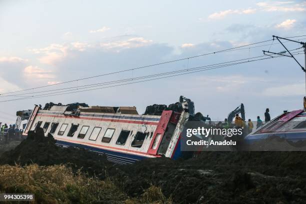 Officials work at the scene after several bogies of a passenger train derailed at the Sarilar village of Tekirdags Corlu district on July 09, 2018....