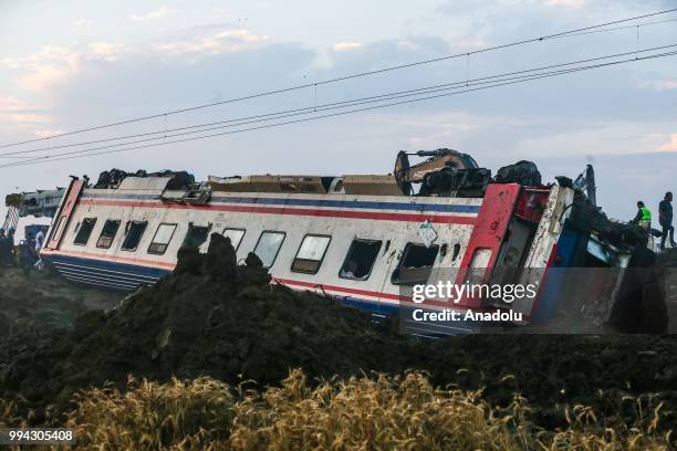 Officials work at the scene after several bogies of a passenger train derailed at the Sarilar village of Tekirdags Corlu district on July 09, 2018....