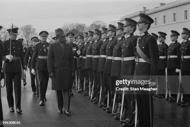 President Mobutu Sese Seko of Zaire pictured inspecting a line of graduating British Army officers at the Royal Military Academy Sandhurst in...