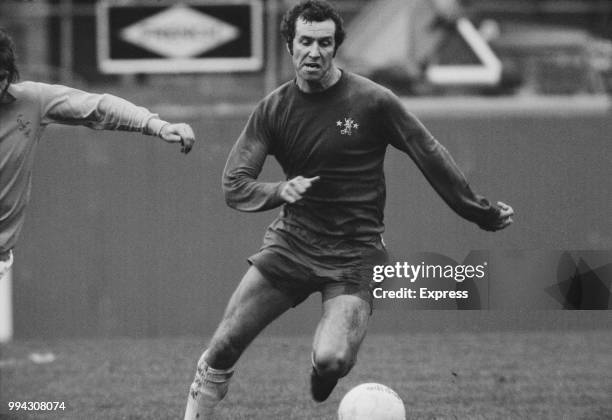 English professional footballer and forward with Chelsea FC, Peter Osgood pictured with the ball during play in the League Division One match between...