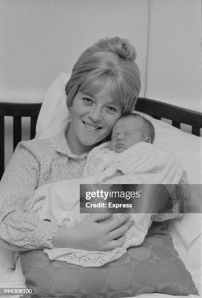 English actress Julia Foster pictured with her newborn son Ben Fogle in London on 13th November 1973.