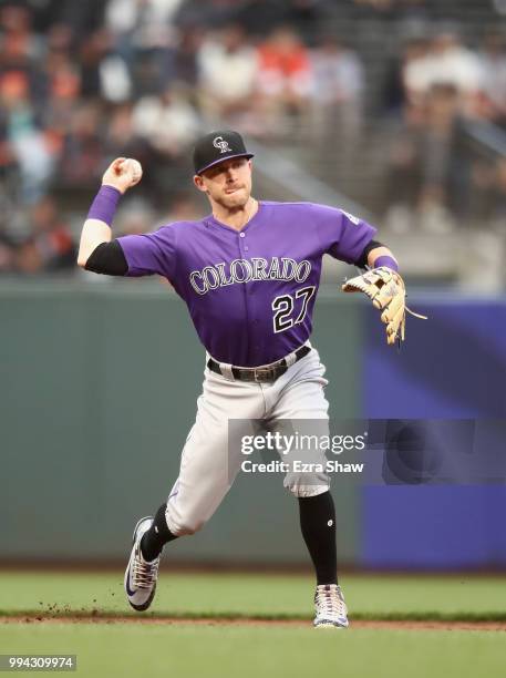 Trevor Story of the Colorado Rockies throws the ball to first base against the San Francisco Giants at AT&T Park on June 27, 2018 in San Francisco,...