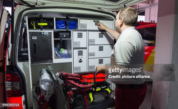 An emergency doctor checks an ambulance at the Feuer- und Rettungswache 3 in Hanover, Germany, 11 August 2017. Photo: Silas Stein/dpa