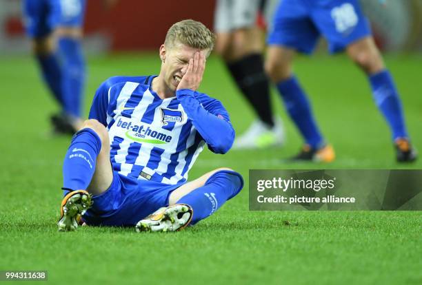Hertha's Mitchell Weiser holding his hand to his head during the Europa League soccer match between Hertha BSC and Athletic Bilbao, group phase,...