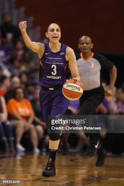 Diana Taurasi of the Phoenix Mercury handles the ball during the first half of WNBA game against the Connecticut Sun at Talking Stick Resort Arena on...