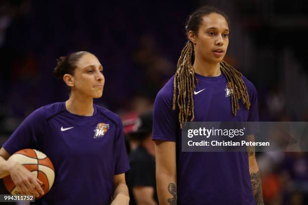 Diana Taurasi and Brittney Griner of the Phoenix Mercury warm up before the WNBA game against the Connecticut Sun at Talking Stick Resort Arena on...