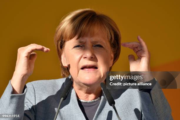 German Chancellor Angela Merkel delivers a speech during an election campaign event of the Christian Democratic Union of Germany held in front of the...