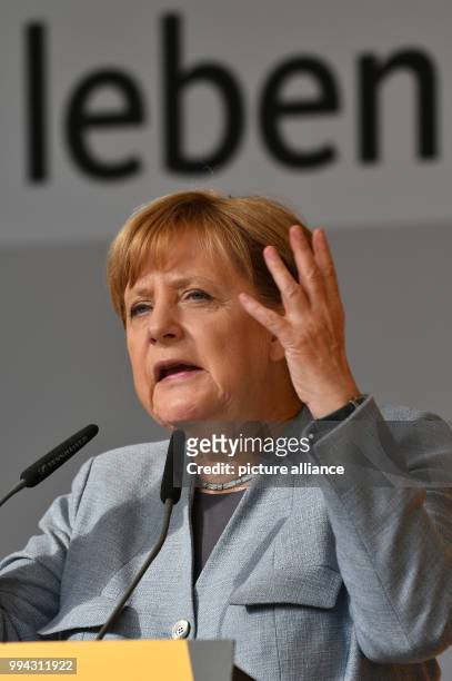 German Chancellor Angela Merkel delivers a speech during an election campaign event of the Christian Democratic Union of Germany held in front of the...