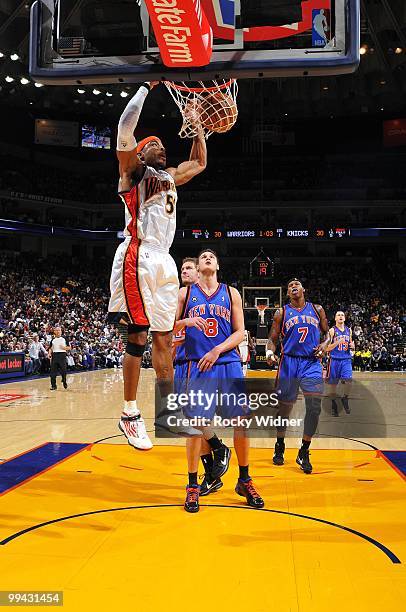 Corey Maggette of the Golden State Warriors dunks against Danilo Gallinari of the New York Knicks during the game at Oracle Arena on April 2, 2010 in...