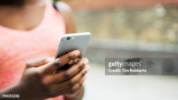 close up of woman using smart phone - mobile phone hand stock pictures, royalty-free photos & images