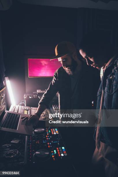 hipster music producer and singer working together in recording studio - music producer stock pictures, royalty-free photos & images