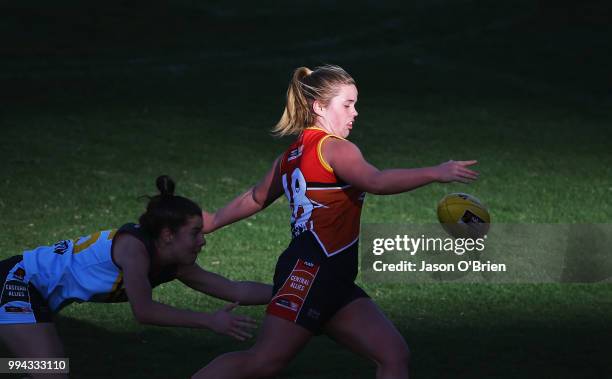 Central's Madisyn Freeman runs with the ball during the AFLW U18 Championships match between Eastern Allies and Central Allies at Metricon Stadium on...