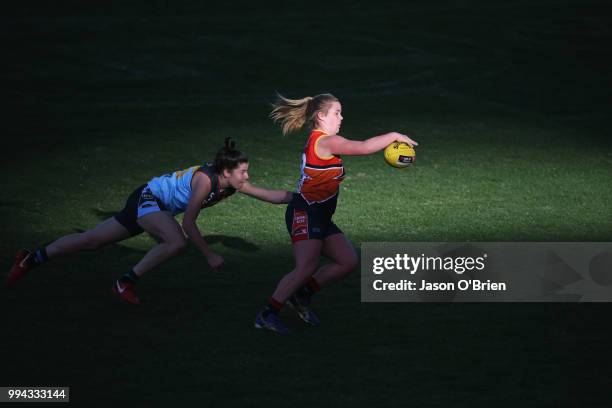 Central's Madisyn Freeman runs with the ball during the AFLW U18 Championships match between Eastern Allies and Central Allies at Metricon Stadium on...