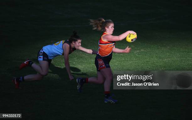 Central's Madisyn Freeman runs with the ball during the AFLW U18 Championships match between Eastern Allies and Central Allies at Metricon Stadium on...