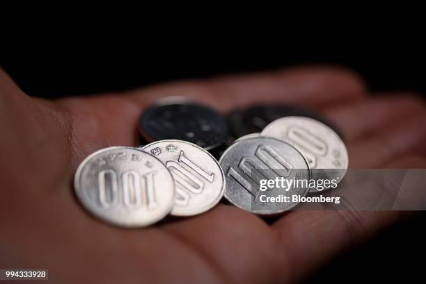 Japanese 100 yen coins are arranged for a photograph in Kawasaki, Kanagawa Prefecture, Japan, on Saturday, July 7, 2018. Japans currency rose against...