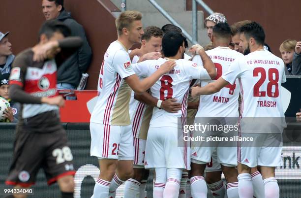 Dpatop - Ingolstadt's players celebrate after the 1-0 by Sonny Kittel during the German 2nd Bundesliga soccer match between FC St. Pauli and FC...