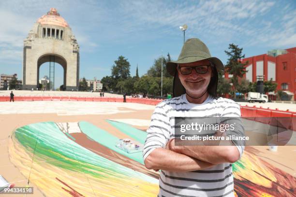 The German painter Edgar Müller sitting by his unfinished painting "Amor Eterno" in Mexico City, Mexico, 15 September 2017. Is is going to be one of...