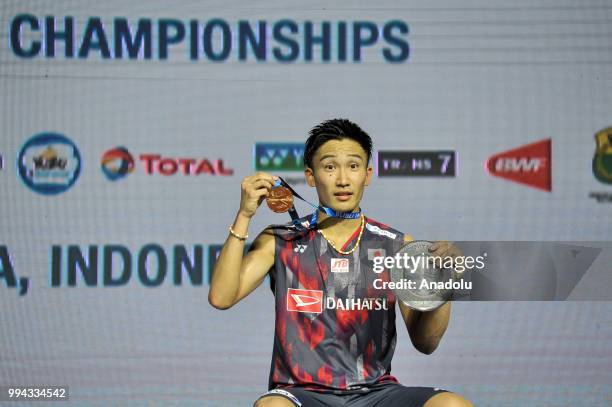 Kento Momota from Japan celebrates his victory after the final match of the men's singles Indonesia Open against Vicktor Axelsen from Denmark, at...