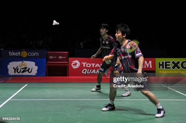 Takuto Inoue and Yuki Kaneko of Japan in action against Markus Renaldi Gideon and Kevin Sanjaya Sukamuljo of Indonesia during the men's doubles final...