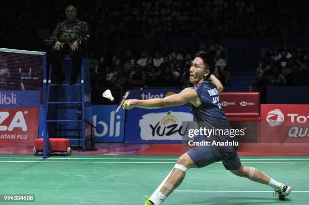 Kento Momota of Japan in action againts Viktor Axelsen of Denmark during men's singles final match at Istora Gelora Bung Karno in Jakarta, Indonesia...
