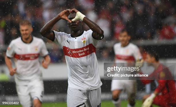 Stuttgart's Chadrac Akolo rejoices over his 1-0 goal during the German Bundesliga soccer match between VfB Stuttgart and VfL Wolfsburg at the...