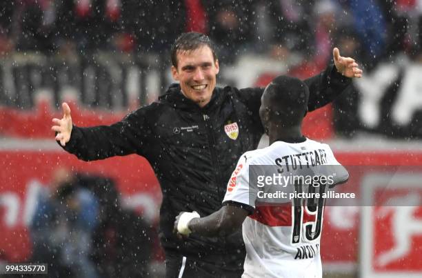 Stuttgart's Chadrac Akolo celebrates his 1-0 goal with Stuttgart's coach Hannes Wolf during the German Bundesliga soccer match between VfB Stuttgart...
