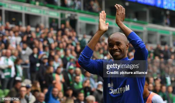 Schalke's Naldo welcomes Werder's fans during the German Bundesliga soccer match between Werder Bremen and FC Schalke 04 in the Weserstadion in...