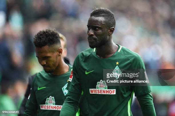 Bremen's Lamine Sané and Theodor Gebre Selassie go to their half-time break during the German Bundesliga soccer match between Werder Bremen and FC...