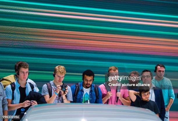 Visitors take a look at a Audi A8 Quattro in Frankfurt am Main, Germany, 16 September 2017. The International Motor Show Germany takes place from...