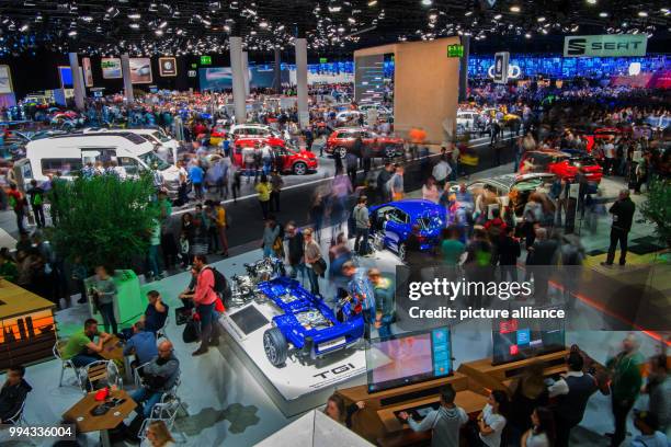 Visitors of the Motor Show take a look at the Volkswagen vehicles in the VW hall in Frankfurt am Main, Germany, 16 September 2017. The International...