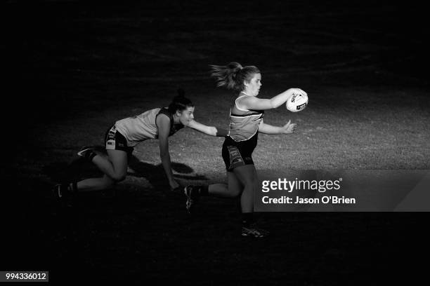 Central's Madisyn Freeman runs with the ball during the AFLW U18 Championships match between Eastern Allies and Central Allies at Metricon Stadium on...