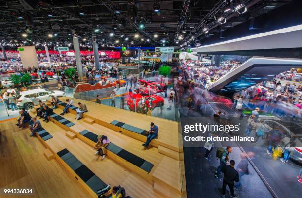Visitors of the Motor Show take a look at the Volkswagen vehicles in the VW hall in Frankfurt am Main, Germany, 16 September 2017. The International...