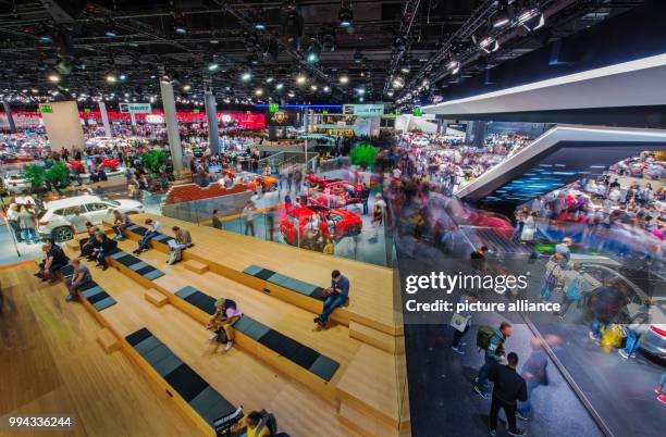 Visitors of the International Motor Show take a look at the Volkswagen vehicles in the VW hall in Frankfurt am Main, Germany, 16 September 2017. The...