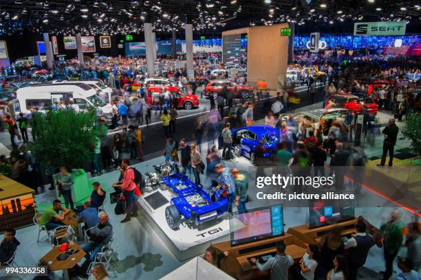 Visitors of the International Motor Show take a look at the Volkswagen vehicles in the VW hall in Frankfurt am Main, Germany, 16 September 2017. The...