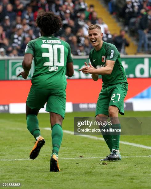 Augsburg's Francisco da Silva Caiuby celebrates his 2-0 goal with teammate Alfred Finnbogason during the German Bundesliga soccer match between...