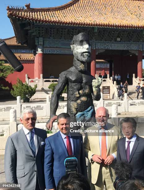 The German Foreign Minister Sigmar Gabriel opens the exhibition 'Deutschland 8' while standing in front of the sculpture 'Uranus' by Markus Luepertz...