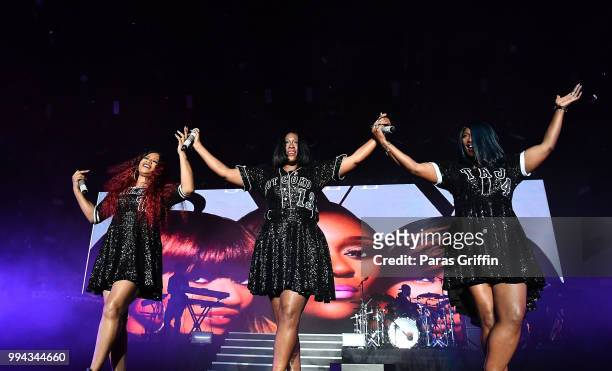 Leanne 'Lelee' Lyons, Cheryl "Coko" Clemons, and Tamara "Taj" Johnson-George of SWV perform onstage during the 2018 Essence Festival - Day 3 at...