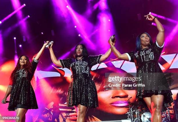 Leanne 'Lelee' Lyons, Cheryl "Coko" Clemons, and Tamara "Taj" Johnson-George of SWV perform onstage during the 2018 Essence Festival - Day 3 at...